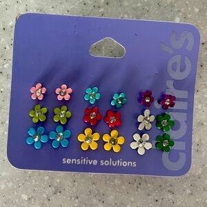 9 pairs metal daisy earrings from Claire’s